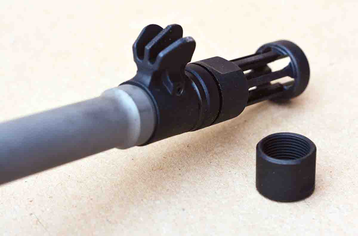 The front sight features protective “wings” and a post-style front blade, while a flash suppressor comes standard.